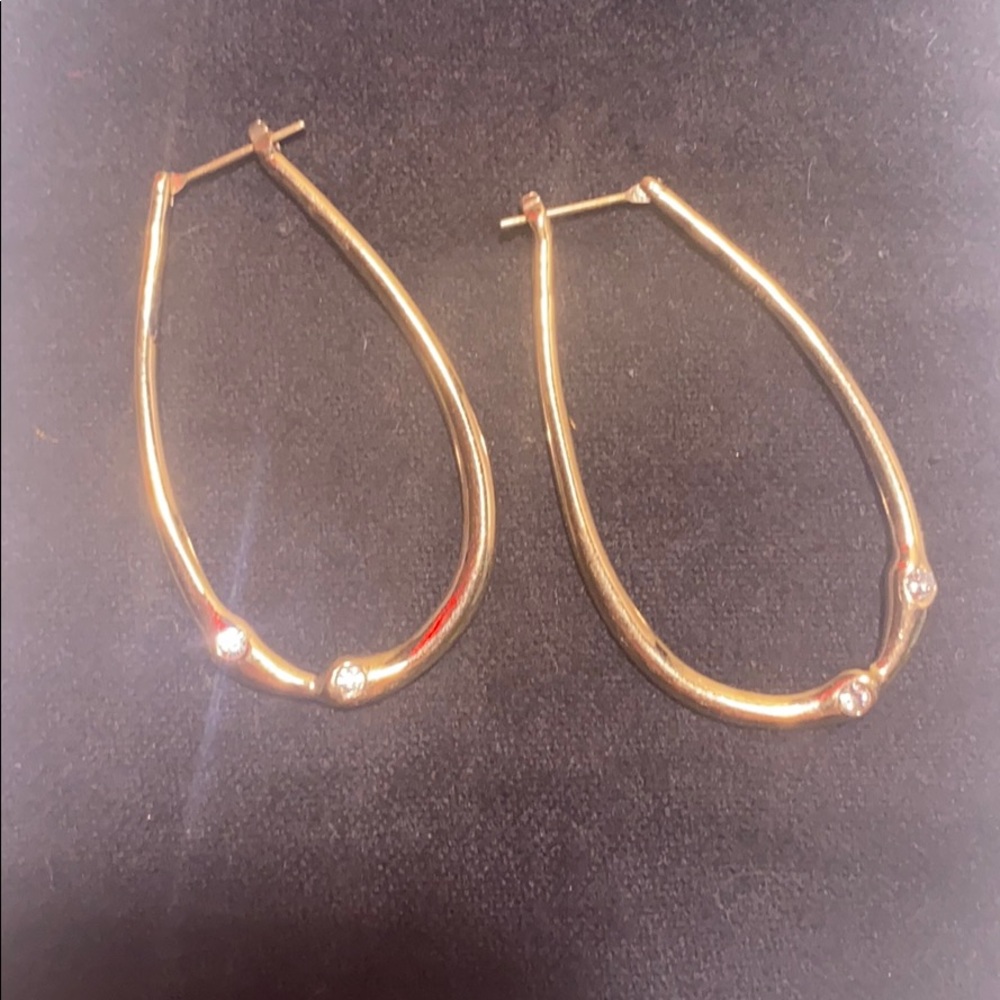 Gold tone hoop earrings with CZ details